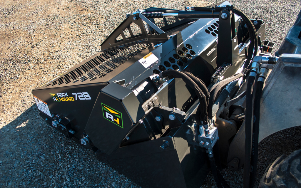 RockHound 72B Landscape Rake mounted on a skid steer showing the hydraulic system and collection bucket.
