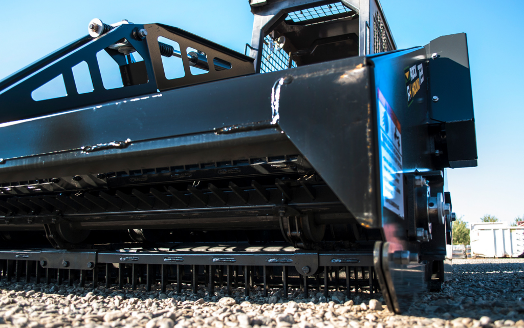 Low-angle view of the RockHound 72B rake bars and ground-working components.