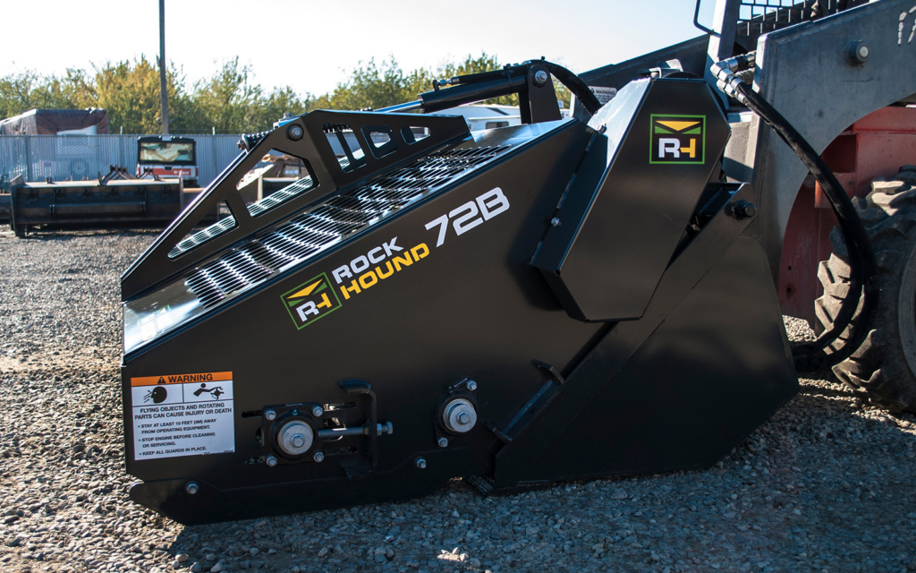 Side view of the RockHound 72B Skid Steer Landscape Rake showing the enclosed drive system and rake housing.