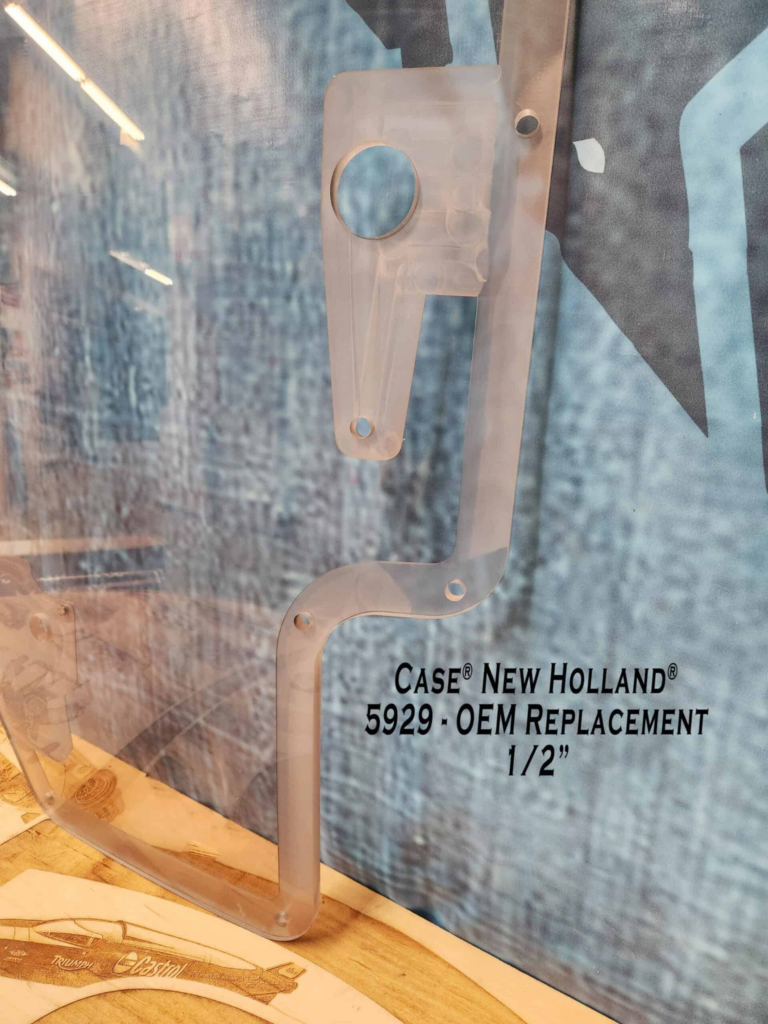 Side view of the SHIELDS Case and New Holland dual-wiper OEM polycarbonate replacement windshield