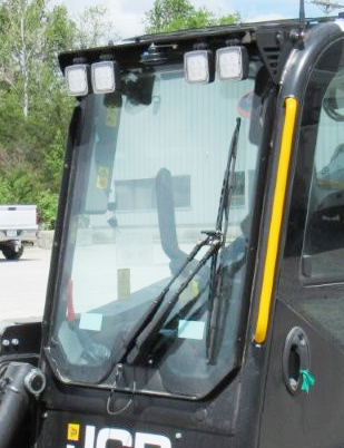 SHIELDS JCB #402/P5831 polycarbonate windshield installed on a JCB skid steer cab