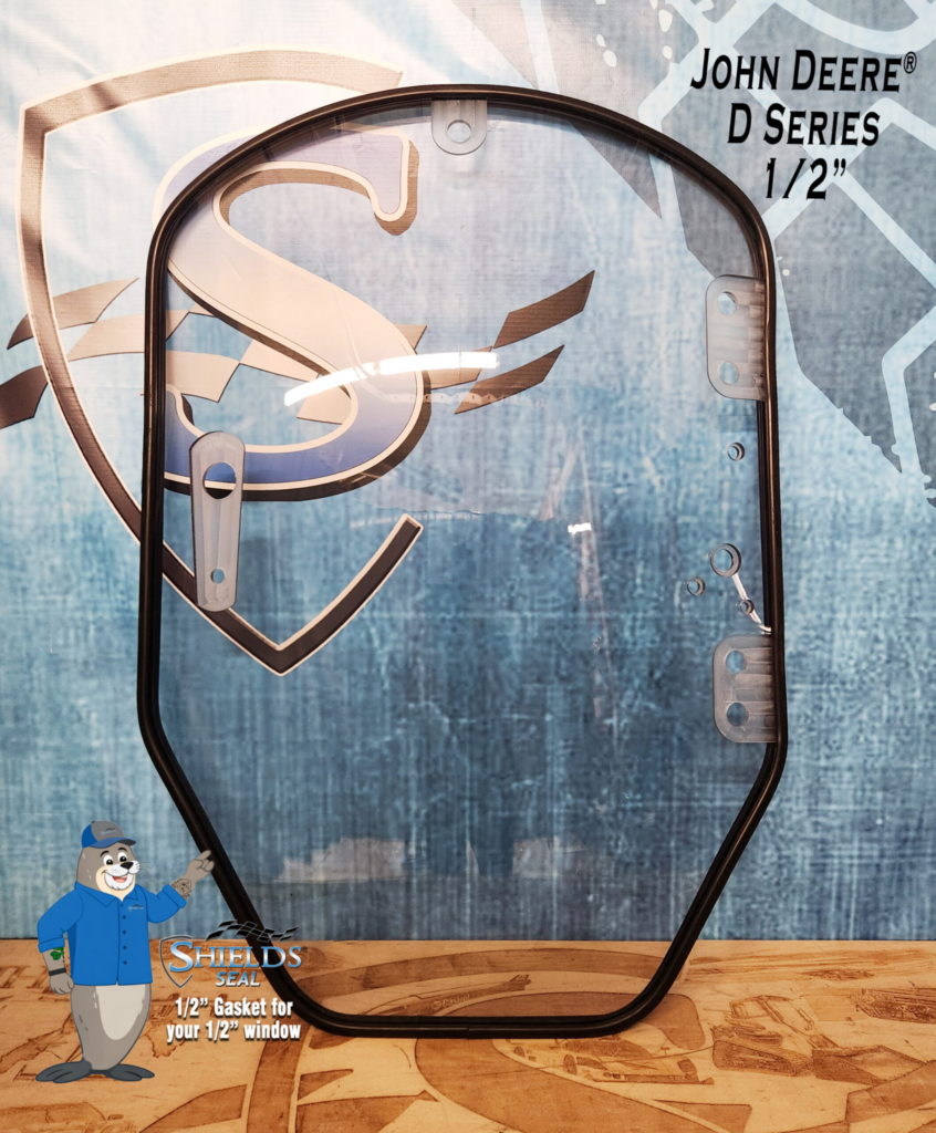 Front view of the SHIELDS John Deere D and E Series half-inch clear polycarbonate windshield with SHIELDS Seal
