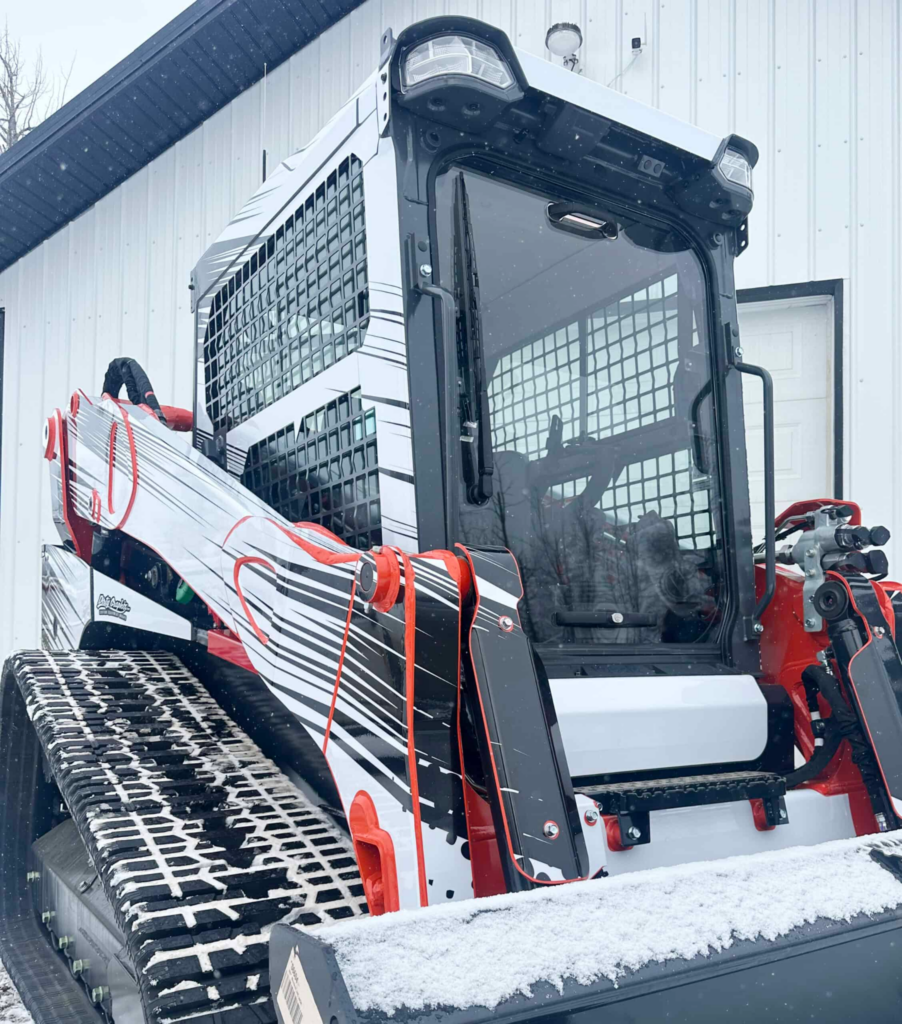 SHIELDS Kubota SVL polycarbonate windshield installed on skid steer in winter conditions