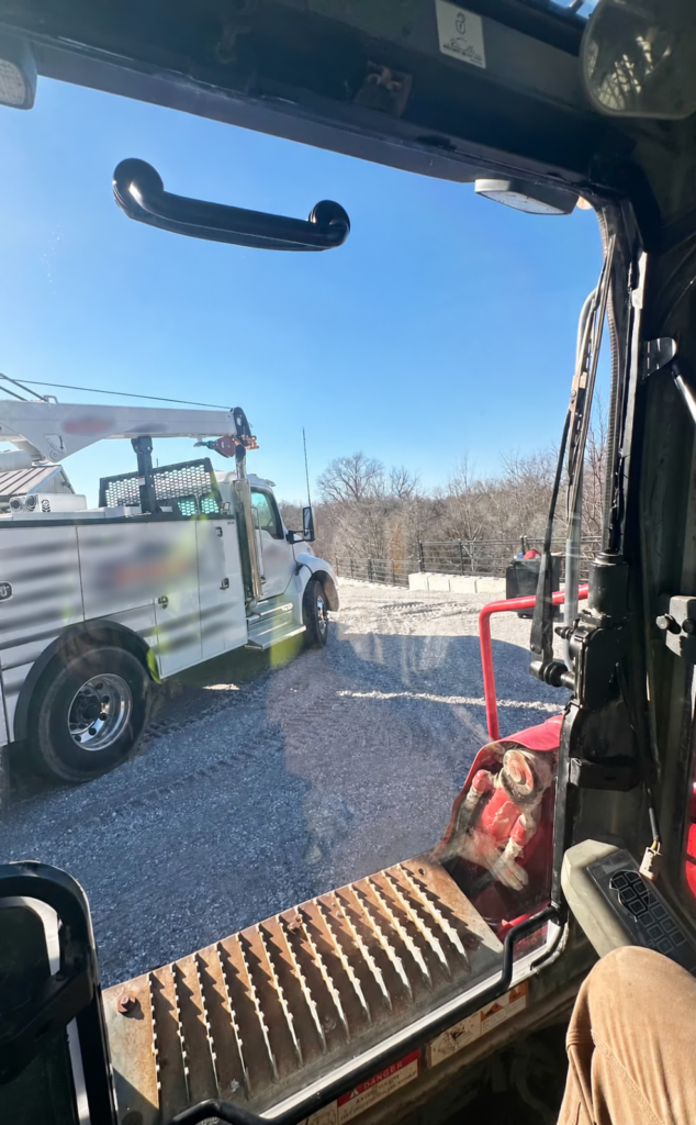 Interior view through a SHIELDS Takeuchi TL Series polycarbonate skid steer windshield