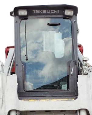 SHIELDS polycarbonate windshield installed on a Takeuchi TL250 skid steer