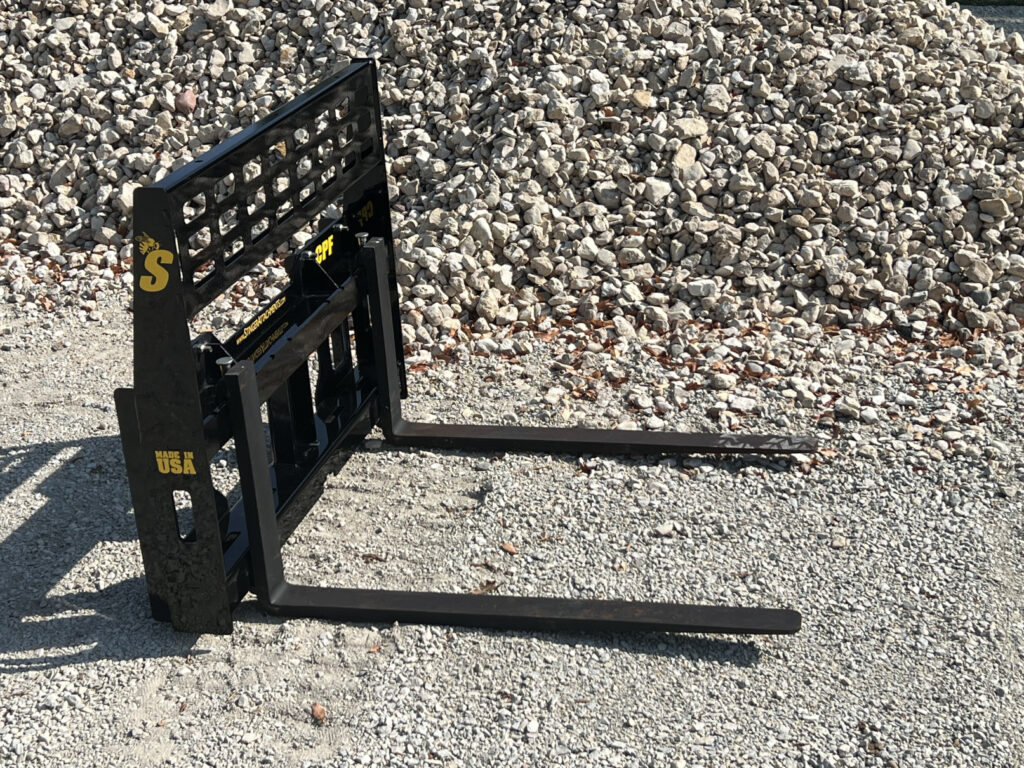 Opposite angled view of the Stinger Attachments CPF Mini Skid Steer Compact Pallet Fork with long forks and see-through load guard