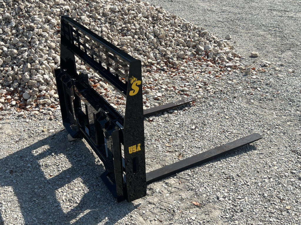 Rear angled view of the Stinger Attachments CPF Mini Skid Steer Compact Pallet Fork showing the bolt-on mounting frame