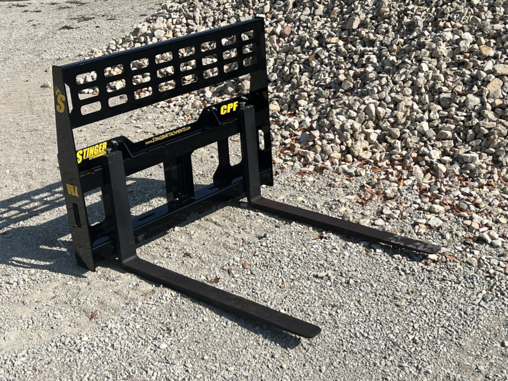 Wide angled view of the Stinger Attachments CPF Mini Skid Steer Compact Pallet Fork showing the fork carriage and open rear guard
