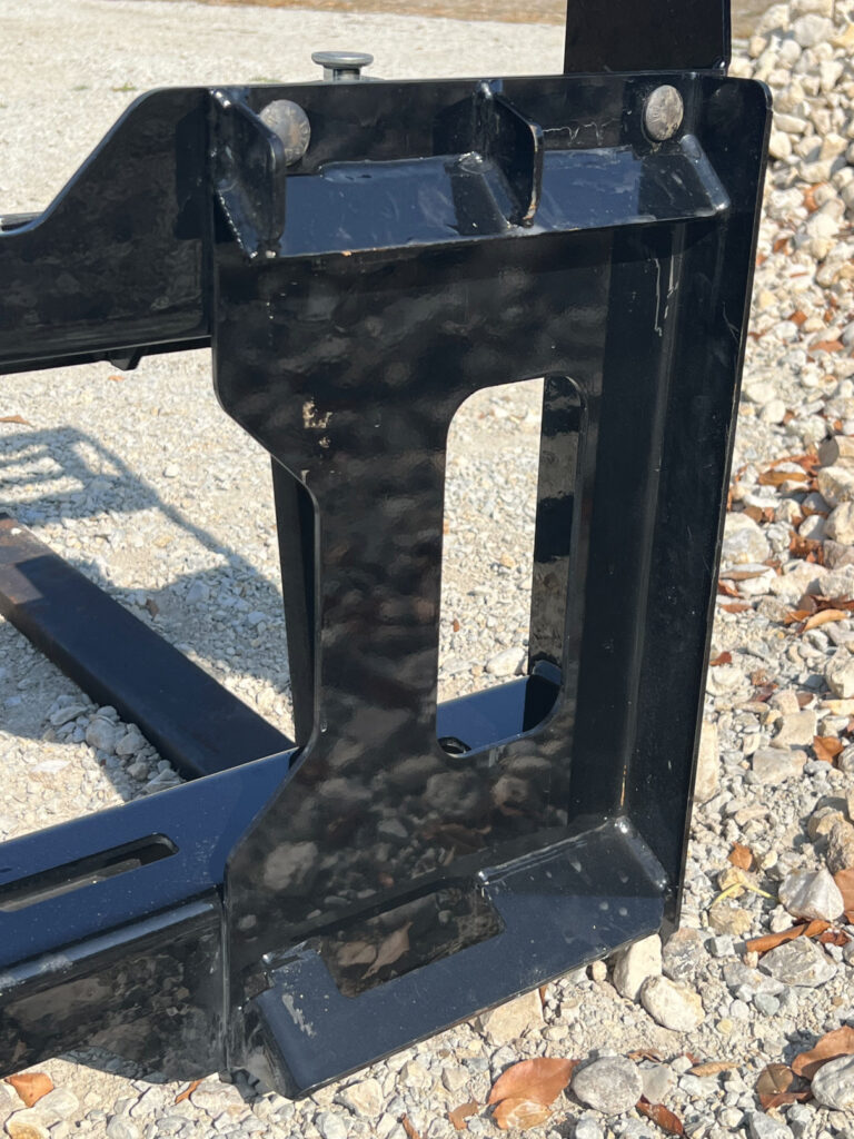 Stinger CPF compact pallet fork frame close-up showing reinforced side plate and bolt-on mounting points