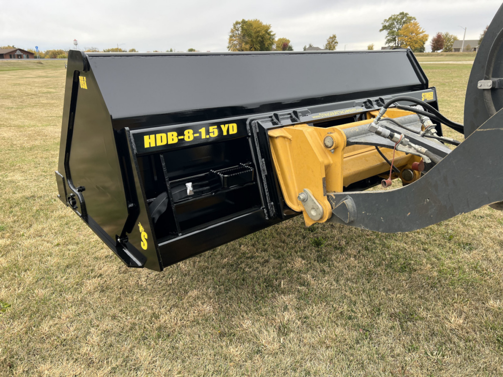 Rear view of the Stinger HDB Wheel Loader Hydraulic Dump Bucket mounted on a John Deere wheel loader