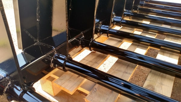 Close-up of replaceable steel tines on Stinger manure grapple