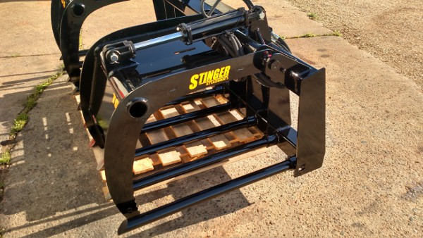 Angled view of Stinger skid steer manure tine grapple