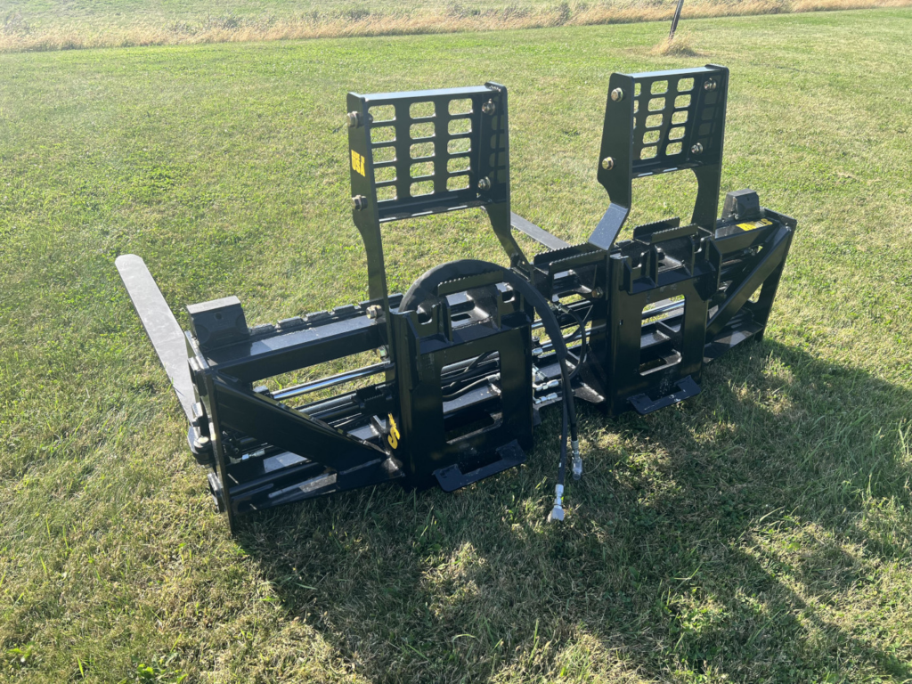 Rear view of Stinger PF3H hydraulic pallet forks showing loader mount, hydraulic lines and backrests