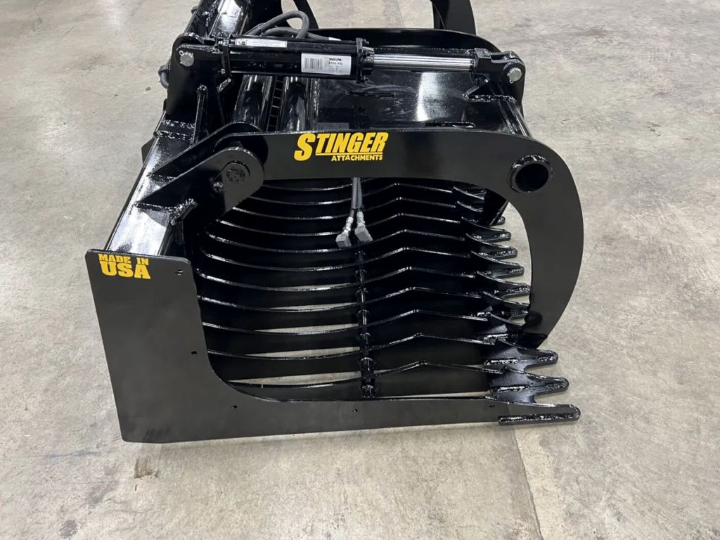 Rear angle view of Stinger RG skid steer rock grapple