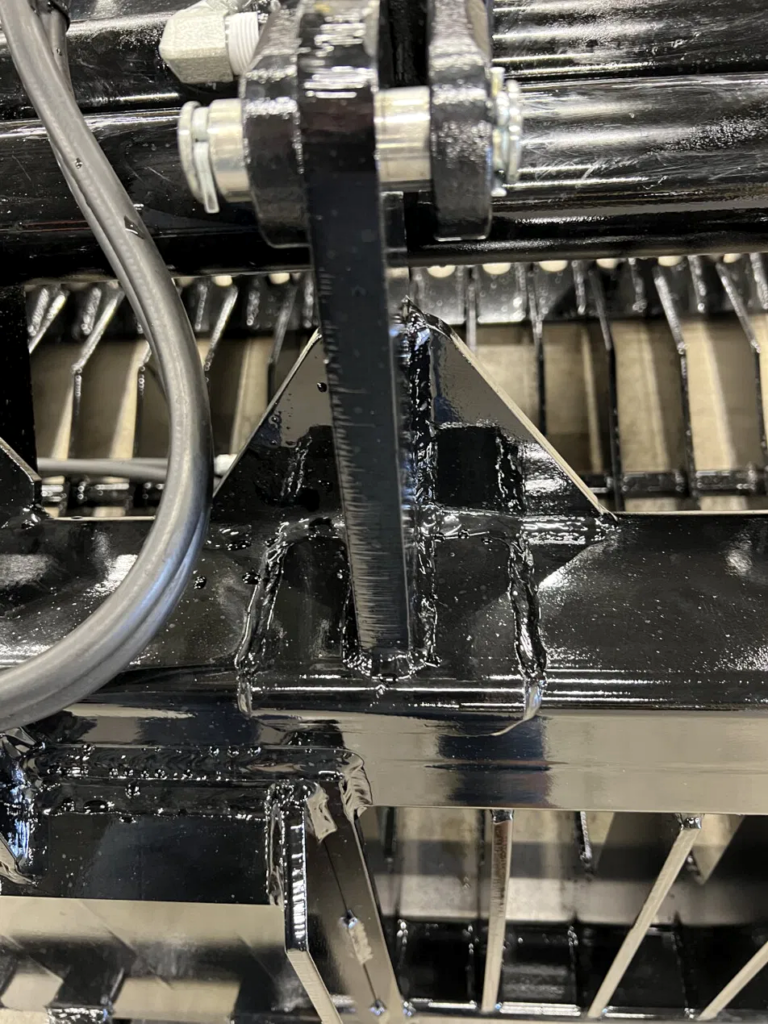 Close-up of contoured tines on a Stinger skid steer rock grapple