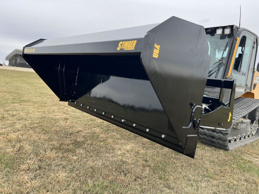 Stinger skid steer hydraulic dump bucket mounted on a compact track loader