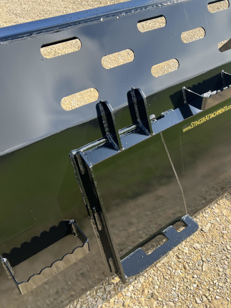 Close-up of the Stinger SNB Wheel Loader Snow Bucket showing the rear mounting plate and safety step