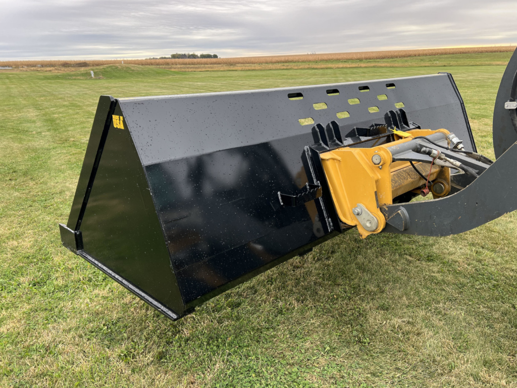 Rear angled view of the Stinger SNB Wheel Loader Snow Bucket mounted on a wheel loader