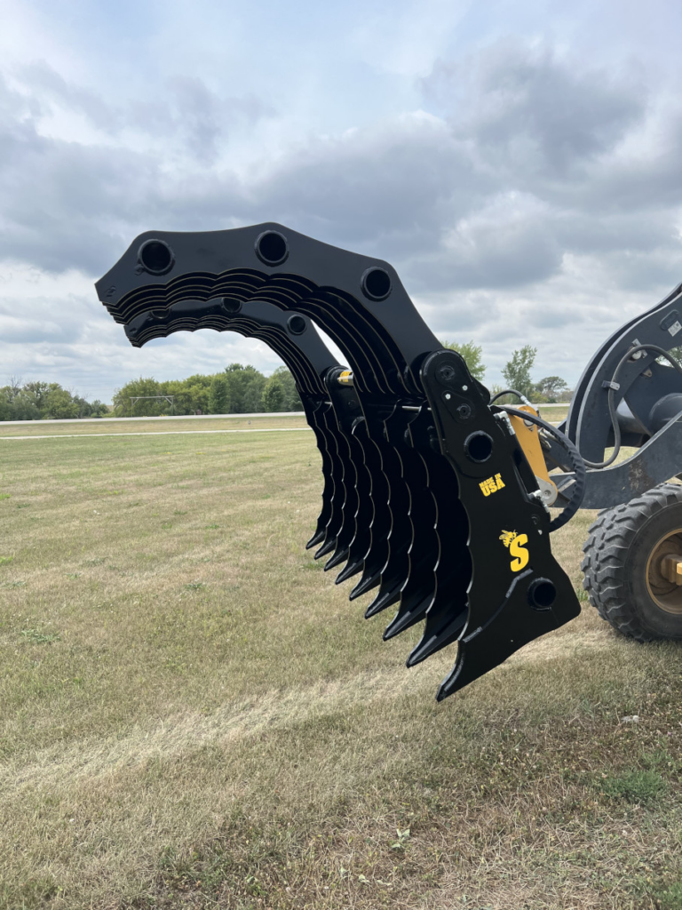 Profile view of the Stinger Wheel Loader Clam Grapple fully open, showing the dual grapple sections and curved tines