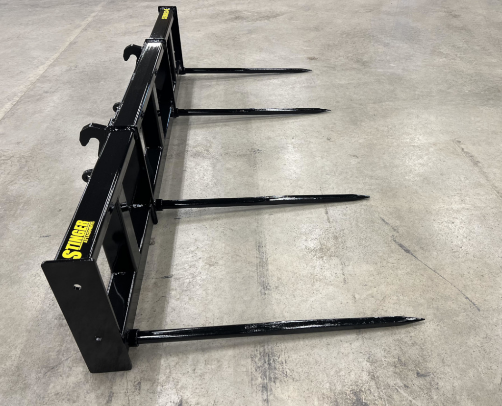 Side view of the Stinger Wheel Loader Double Round Bale Spear showing the four long replaceable spears and wide support frame