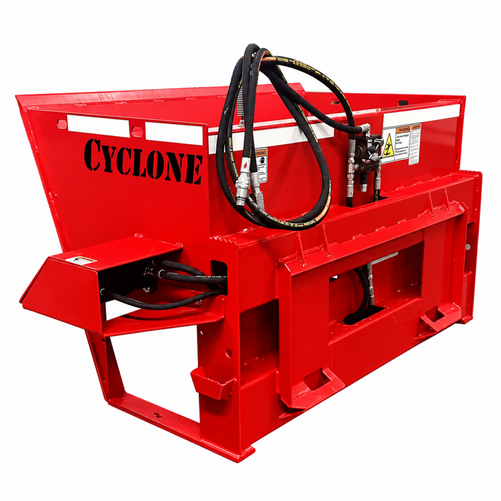 Rear right angled view of the Stout Cyclone skid steer material spreader showing the hydraulic hoses, mounting frame, and hopper