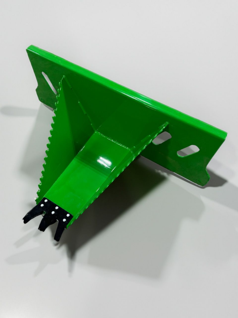 Angled studio view of the John Deere Green SWAT Metal Works Heavy Duty Stump Buster showing the 24-inch snout, serrated sides, and replaceable cutting edge.